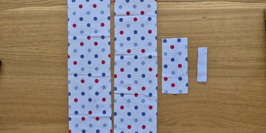 Three fabric rectangles cut from a fat quarter for making a twisted headband. Plus a piece of elastic