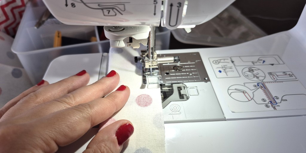 Sewing the headband fabric piece lengthwise to create a tube.