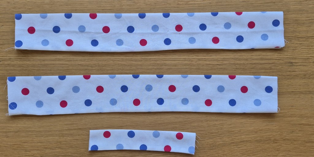 Turning the sewn fabric tube right side out for the twisted headband.